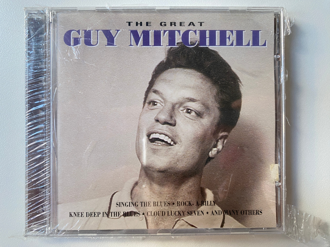 https://cdn10.bigcommerce.com/s-62bdpkt7pb/products/0/images/302103/The_Great_Guy_Mitchell_-_Singing_The_Blues_Rock_A-Billy_Knee_Deep_In_The_Blues_Cloud_Lucky_Seven_And_Many_Others_Goldies_Audio_CD_GLD_63241_1__07972.1695985818.1280.1280.jpg?c=2&_gl=1*1214u1h*_ga*MjA2NTIxMjE2MC4xNTkwNTEyNTMy*_ga_WS2VZYPC6G*MTY5NTk4NTEzMC4xMDc3LjEuMTY5NTk4NTY1Mi4yNC4wLjA.