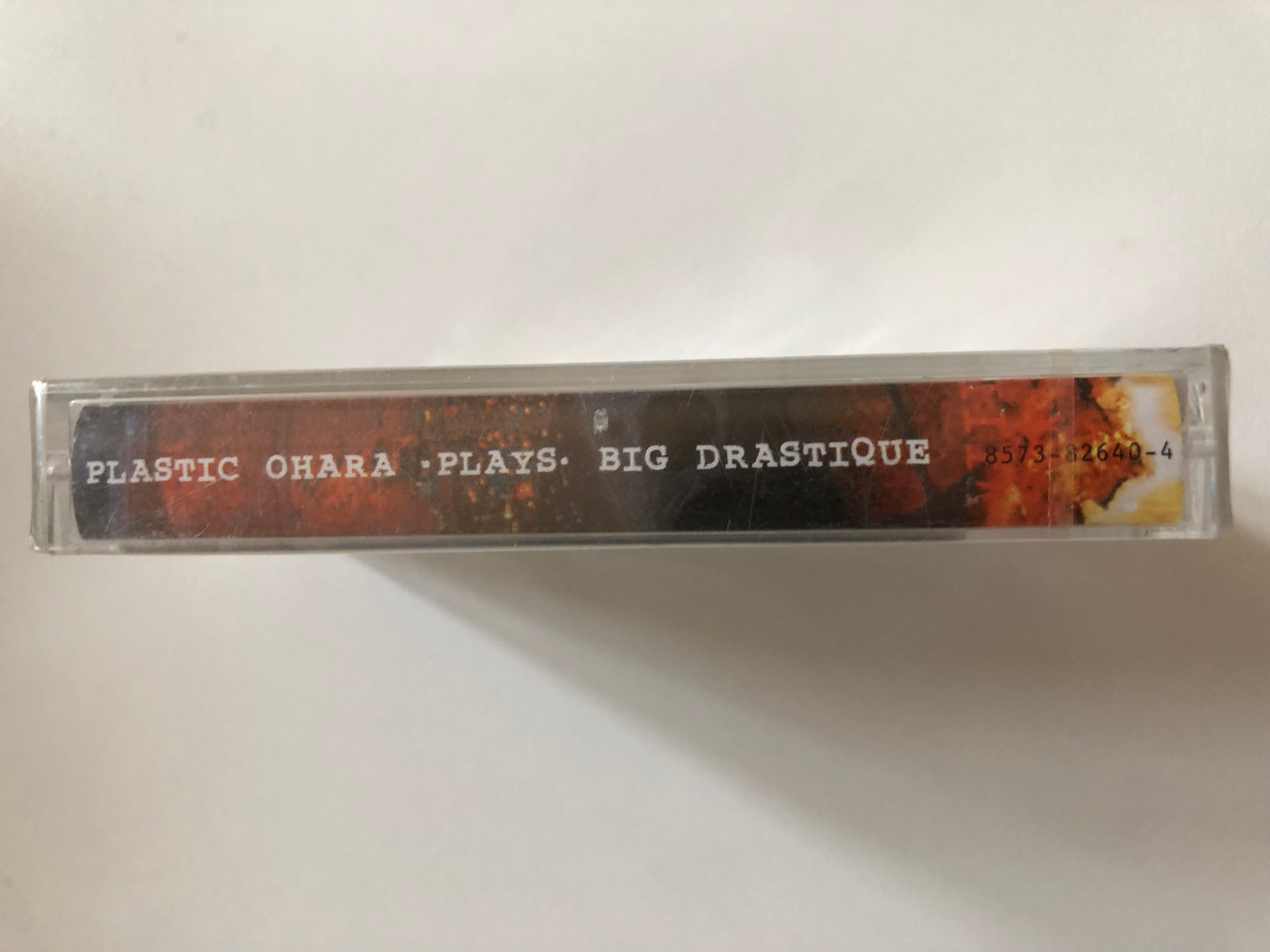https://cdn10.bigcommerce.com/s-62bdpkt7pb/products/0/images/302236/Plastic_Ohara_Plays_Big_Drastique_Warner_Music_Hungary_Audio_Cassette_2000_8573-82640-4_3__22474.1696313993.1280.1280.JPG?c=2&_gl=1*ti1z70*_ga*MjA2NTIxMjE2MC4xNTkwNTEyNTMy*_ga_WS2VZYPC6G*MTY5NjMxMzMwMy4xMDgxLjEuMTY5NjMxMzgyOS40OS4wLjA.