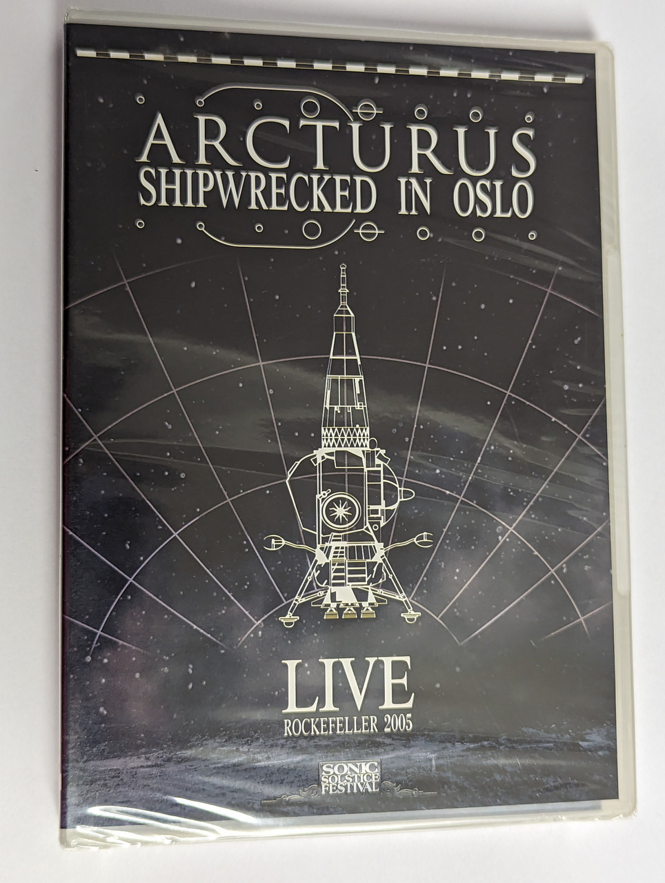 https://cdn10.bigcommerce.com/s-62bdpkt7pb/products/0/images/302468/Arcturus_Shipwrecked_In_Oslo_-_Live_Rockefeller_2005_Season_Of_Mist_DVD_Video_CD_SOM_128_1__64830.1696412650.1280.1280.jpg?c=2&_gl=1*19236hl*_ga*MjA2NTIxMjE2MC4xNTkwNTEyNTMy*_ga_WS2VZYPC6G*MTY5NjQwNzEwMS4xMDg1LjEuMTY5NjQxMjY1MS42MC4wLjA.