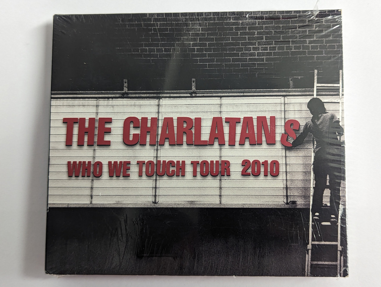 https://cdn10.bigcommerce.com/s-62bdpkt7pb/products/0/images/302569/The_Charlatans_Who_We_Touch_Tour_2010_Concert_Live_3x_Audio_CD_CLCD316_1__09887.1696502351.1280.1280.jpg?c=2&_gl=1*1hyfr7f*_ga*MjA2NTIxMjE2MC4xNTkwNTEyNTMy*_ga_WS2VZYPC6G*MTY5NjQ5NDU2NS4xMDg4LjEuMTY5NjUwMjIyMS4xMC4wLjA.