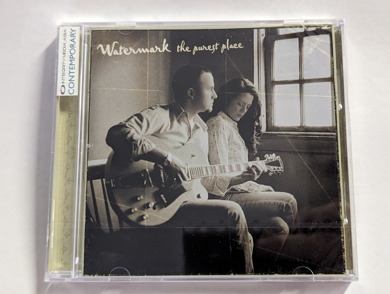 https://cdn10.bigcommerce.com/s-62bdpkt7pb/products/0/images/302787/Watermark_The_Purest_Place_Rocketown_Records_Audio_CD_2004_RRD3228_1__57097.1696863054.1280.1280.jpg?c=2&_gl=1*1a7quo1*_ga*MjA2NTIxMjE2MC4xNTkwNTEyNTMy*_ga_WS2VZYPC6G*MTY5Njg1OTUxMS4xMDkzLjEuMTY5Njg2MjY4MS40LjAuMA..
