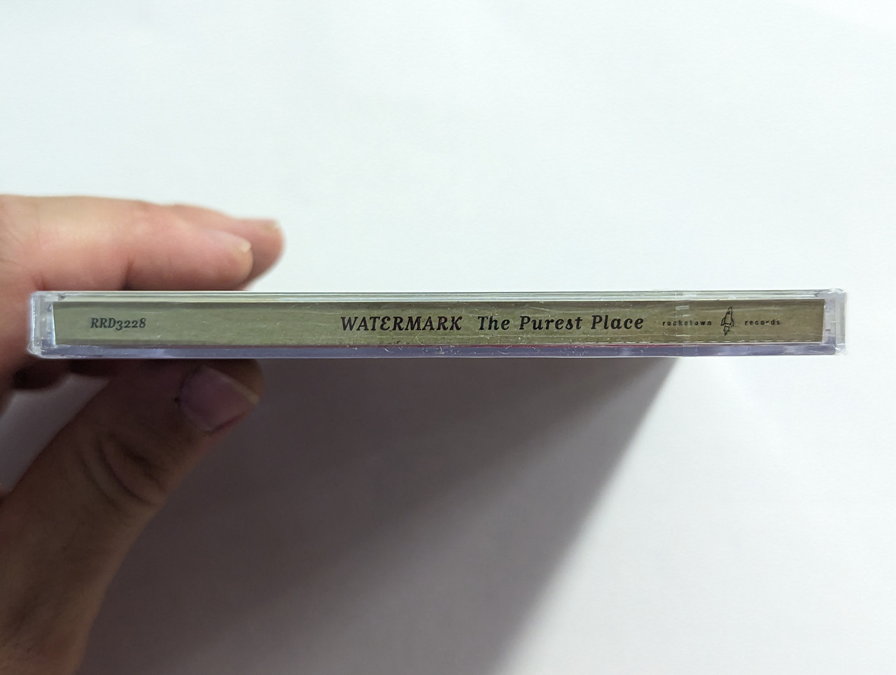https://cdn10.bigcommerce.com/s-62bdpkt7pb/products/0/images/302789/Watermark_The_Purest_Place_Rocketown_Records_Audio_CD_2004_RRD3228_3__75771.1696863066.1280.1280.jpg?c=2&_gl=1*1a7quo1*_ga*MjA2NTIxMjE2MC4xNTkwNTEyNTMy*_ga_WS2VZYPC6G*MTY5Njg1OTUxMS4xMDkzLjEuMTY5Njg2MjY4MS40LjAuMA..