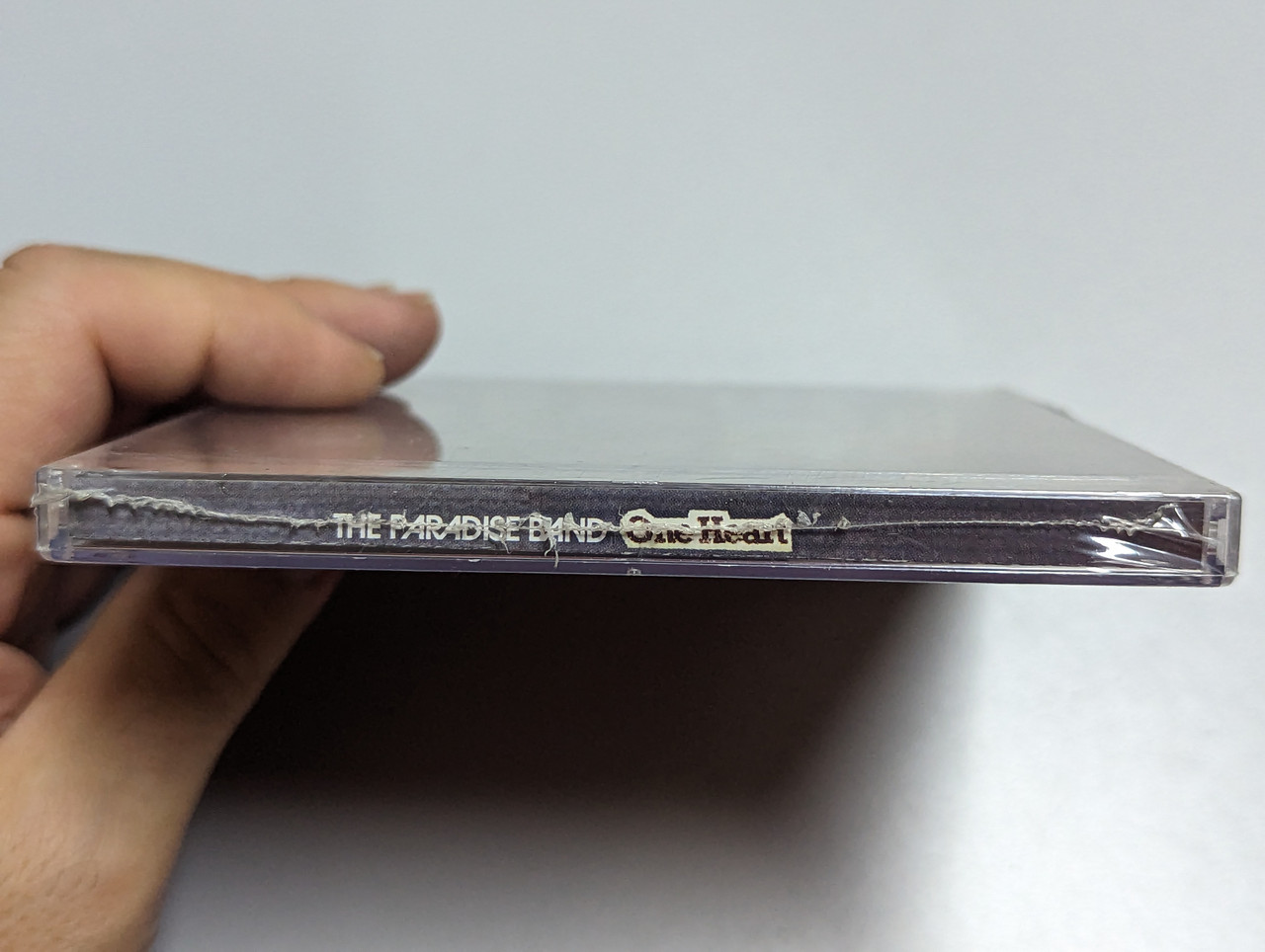 https://cdn10.bigcommerce.com/s-62bdpkt7pb/products/0/images/303183/The_Paradise_Band_One_Heart_Paradise_Entertainment_Audio_CD_3__58917.1696959664.1280.1280.jpg?c=2&_gl=1*9uk5ia*_ga*MjA2NTIxMjE2MC4xNTkwNTEyNTMy*_ga_WS2VZYPC6G*MTY5Njk1OTA2Mi4xMDk2LjEuMTY5Njk1OTY0OS42MC4wLjA.