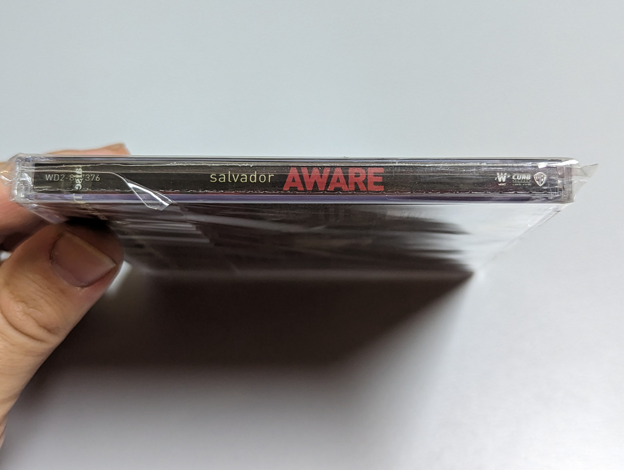 https://cdn10.bigcommerce.com/s-62bdpkt7pb/products/0/images/303198/Salvador_Aware_Word_Audio_CD_2008_WD2-887376_3__13755.1696961272.1280.1280.jpg?c=2&_gl=1*c7fyp3*_ga*MjA2NTIxMjE2MC4xNTkwNTEyNTMy*_ga_WS2VZYPC6G*MTY5Njk1OTA2Mi4xMDk2LjEuMTY5Njk2MTA0OC41MC4wLjA.