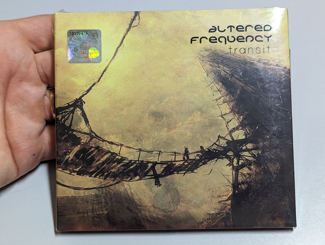 https://cdn10.bigcommerce.com/s-62bdpkt7pb/products/0/images/303199/Altered_Frequency_-_Transit_Four_Forty_Records_Audio_CD_2009_1__82711.1696961634.1280.1280.jpg?c=2&_gl=1*sx1fp1*_ga*MjA2NTIxMjE2MC4xNTkwNTEyNTMy*_ga_WS2VZYPC6G*MTY5Njk1OTA2Mi4xMDk2LjEuMTY5Njk2MTQzNS40Ni4wLjA.