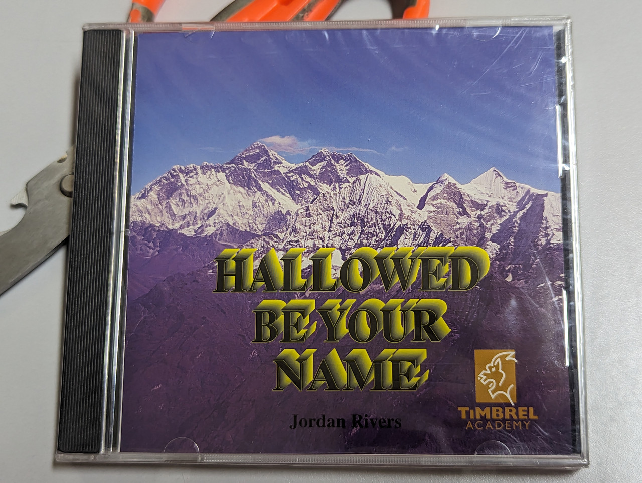 https://cdn10.bigcommerce.com/s-62bdpkt7pb/products/0/images/303362/Hallowed_Be_Your_Name_-_Jordan_Rivers_Timbrel_Academy_Audio_CD_1995_1__77794.1697029821.1280.1280.jpg?c=2&_gl=1*jnoqor*_ga*MjA2NTIxMjE2MC4xNTkwNTEyNTMy*_ga_WS2VZYPC6G*MTY5NzAyOTYwNy4xMDk3LjAuMTY5NzAyOTYzOC4yOS4wLjA.
