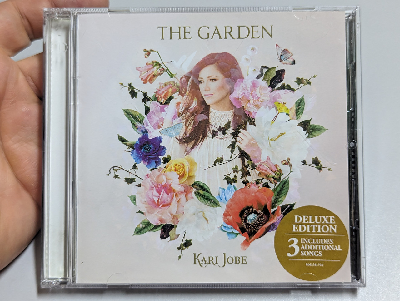 https://cdn10.bigcommerce.com/s-62bdpkt7pb/products/0/images/303389/Kari_Jobe_The_Garden_Deluxe_Edition_Includes_3_Additional_Songs_Sparrow_Records_Audio_CD_2017_B002581702_1__50509.1697036912.1280.1280.jpg?c=2&_gl=1*d0dm24*_ga*MjA2NTIxMjE2MC4xNTkwNTEyNTMy*_ga_WS2VZYPC6G*MTY5NzAyOTYwNy4xMDk3LjEuMTY5NzAzNjU1OS40OS4wLjA.