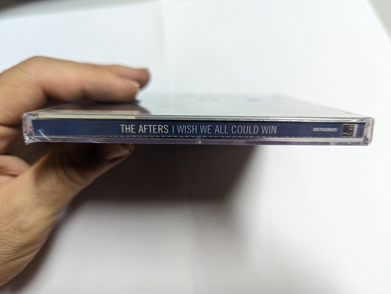 https://cdn10.bigcommerce.com/s-62bdpkt7pb/products/0/images/303434/The_Afters_I_Wish_We_All_Could_Win_Simple_Records_Audio_CD_2005_000768306925_3__80408.1697045611.1280.1280.jpg?c=2&_gl=1*1sq55bj*_ga*MjA2NTIxMjE2MC4xNTkwNTEyNTMy*_ga_WS2VZYPC6G*MTY5NzAyOTYwNy4xMDk3LjEuMTY5NzA0MTU1MS41MC4wLjA.