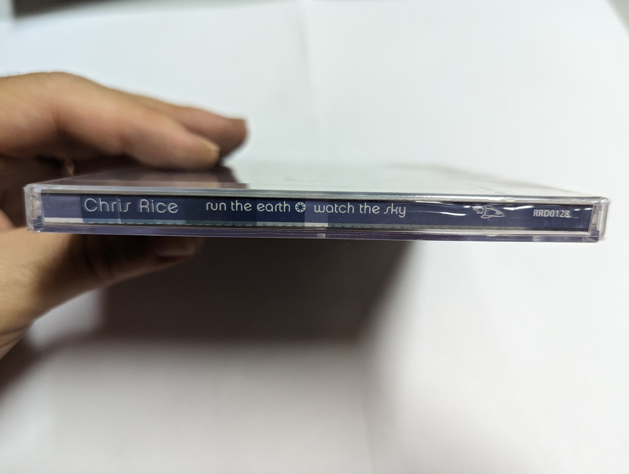 https://cdn10.bigcommerce.com/s-62bdpkt7pb/products/0/images/303452/Chris_Rice_Run_The_Earth_Watch_The_Sky_Rocketown_Records_Audio_CD_RRD0128_4__38426.1697100122.1280.1280.jpg?c=2&_gl=1*7phmzh*_ga*MjA2NTIxMjE2MC4xNTkwNTEyNTMy*_ga_WS2VZYPC6G*MTY5NzA5OTY2MS4xMDk5LjAuMTY5NzA5OTY2MS42MC4wLjA.