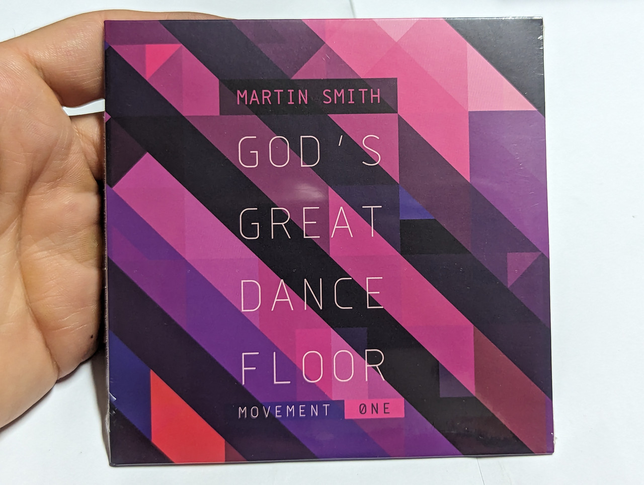 https://cdn10.bigcommerce.com/s-62bdpkt7pb/products/0/images/303685/Martin_Smith_Gods_Great_Dance_Floor_Movement_One_Gloworks_Audio_CD_2012_1__08066.1697119685.1280.1280.jpg?c=2&_gl=1*17hoaue*_ga*MjA2NTIxMjE2MC4xNTkwNTEyNTMy*_ga_WS2VZYPC6G*MTY5NzExODQwOS4xMTAwLjEuMTY5NzExOTY3Ny42MC4wLjA.