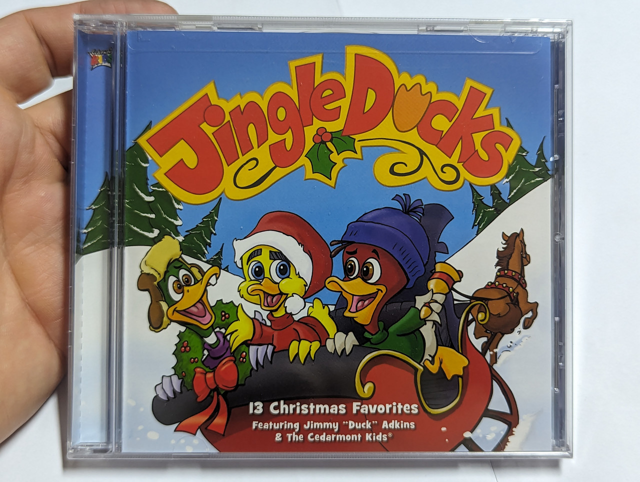 https://cdn10.bigcommerce.com/s-62bdpkt7pb/products/0/images/303692/Jingle_Ducks_-_13_Christmas_Favorites_-_Featuring_Jimmy_Duck_Adkins_The_Cedarmont_Kids_Cedarmont_Music_Audio_CD_2010_84418-0742-2_1__52003.1697121061.1280.1280.jpg?c=2&_gl=1*s9ysg6*_ga*MjA2NTIxMjE2MC4xNTkwNTEyNTMy*_ga_WS2VZYPC6G*MTY5NzExODQwOS4xMTAwLjEuMTY5NzEyMDgzNC42MC4wLjA.