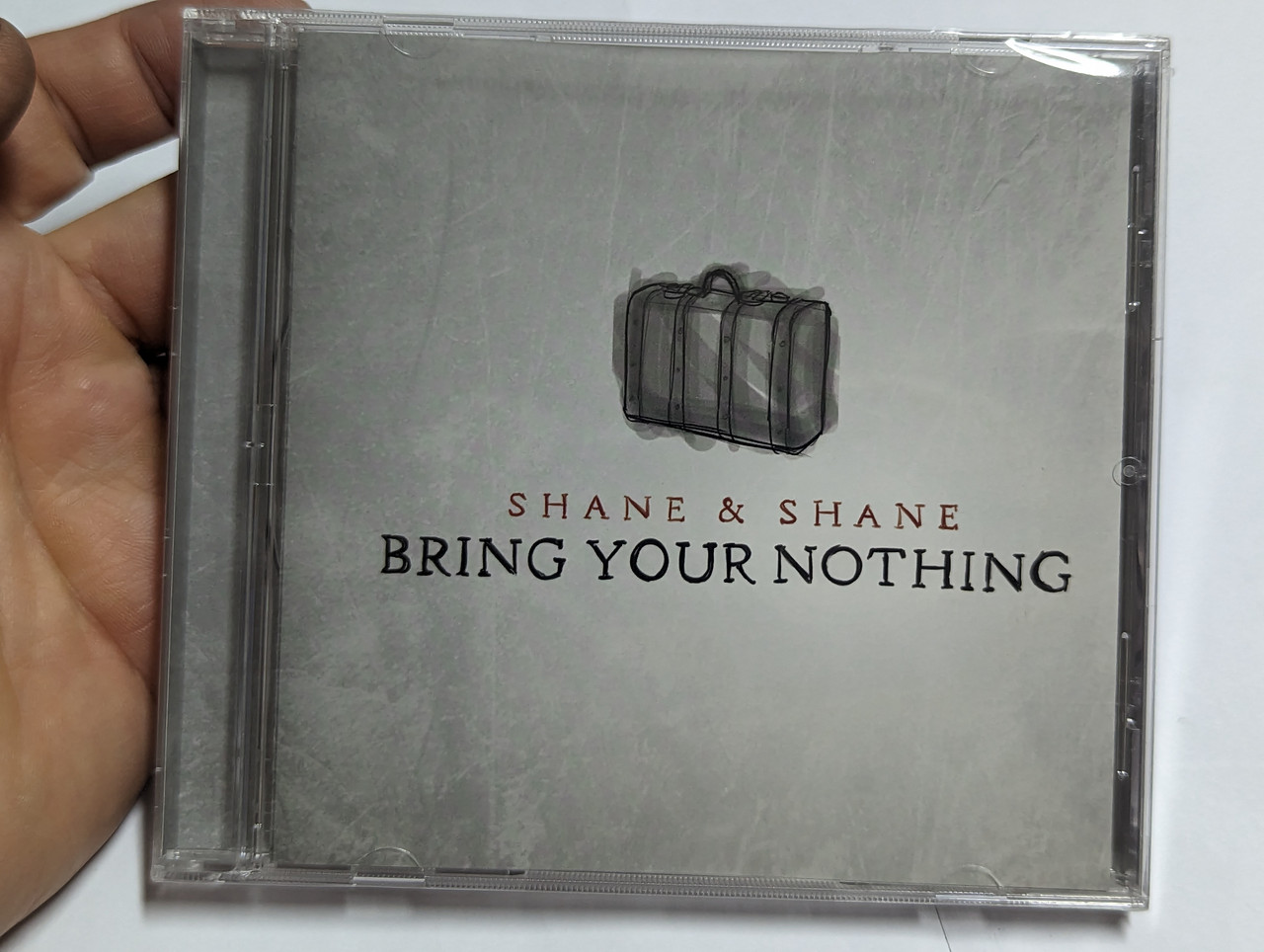 https://cdn10.bigcommerce.com/s-62bdpkt7pb/products/0/images/303746/Shane_Shane_Bring_Your_Nothing_Fairtrade_Services_Audio_CD_2013_3621160619_1__91425.1697204730.1280.1280.jpg?c=2&_gl=1*kgtqql*_ga*MjA2NTIxMjE2MC4xNTkwNTEyNTMy*_ga_WS2VZYPC6G*MTY5NzIwMzE3OS4xMTAyLjEuMTY5NzIwNDY0NC40NC4wLjA.