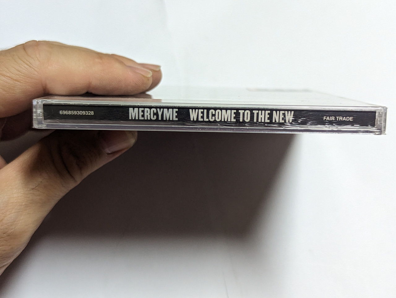 https://cdn10.bigcommerce.com/s-62bdpkt7pb/products/0/images/303899/MercyMe_Welcome_To_The_New_Featuring_The_Hit_Shake_Plus_Greater_and_Flawless_Fair_Trade_Services_Audio_CD_2014_696859309328_3__81410.1697434524.1280.1280.jpg?c=2&_gl=1*y2r791*_ga*MjA2NTIxMjE2MC4xNTkwNTEyNTMy*_ga_WS2VZYPC6G*MTY5NzQzMDkyOS4xMTA0LjEuMTY5NzQzNDQ4MC42MC4wLjA.