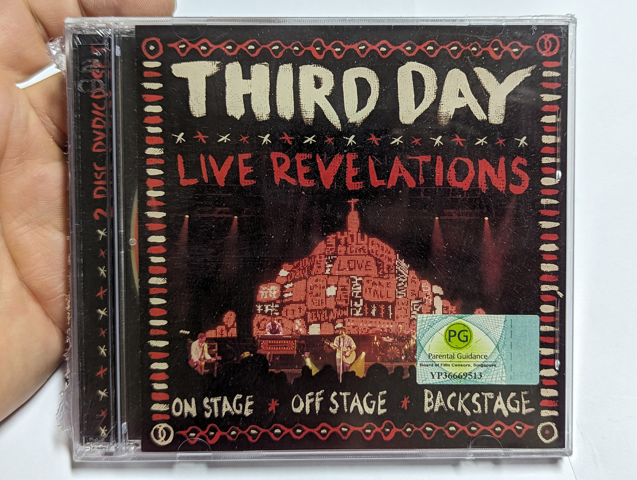 https://cdn10.bigcommerce.com/s-62bdpkt7pb/products/0/images/303939/Third_Day_Live_Revelations_On_Stage_Off_Stage_Backstage_Essential_Records_Audio_CD_DVD_Video_CD_2009_83061-0298-9_1__48276.1697440782.1280.1280.jpg?c=2&_gl=1*92a6ik*_ga*MjA2NTIxMjE2MC4xNTkwNTEyNTMy*_ga_WS2VZYPC6G*MTY5NzQzMDkyOS4xMTA0LjEuMTY5NzQ0MDI3MS44LjAuMA..