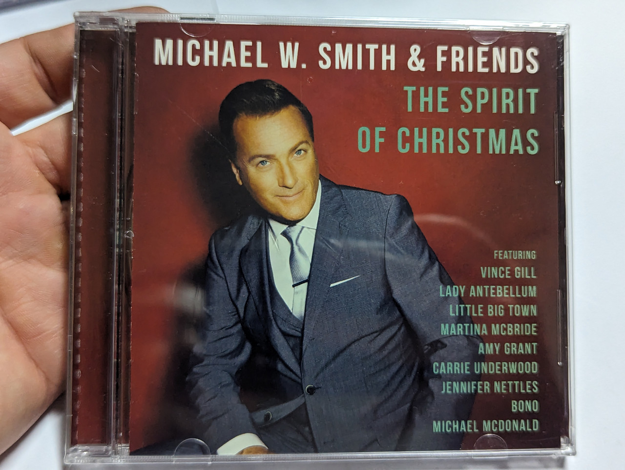 https://cdn10.bigcommerce.com/s-62bdpkt7pb/products/0/images/303960/Michael_W._Smith_Friends_The_Spirit_Of_Christmas_Featuring_Vince_Gill_Lady_Antebellum_Little_Big_Town_Martina_McBride_Amy_Grant_Carrie_Underwood_Jennifer_Nettles_Bono_Michael_McD_1__14388.1697444811.1280.1280.jpg?c=2&_gl=1*38zr99*_ga*MjA2NTIxMjE2MC4xNTkwNTEyNTMy*_ga_WS2VZYPC6G*MTY5NzQzMDkyOS4xMTA0LjEuMTY5NzQ0NDU1NS41MC4wLjA.