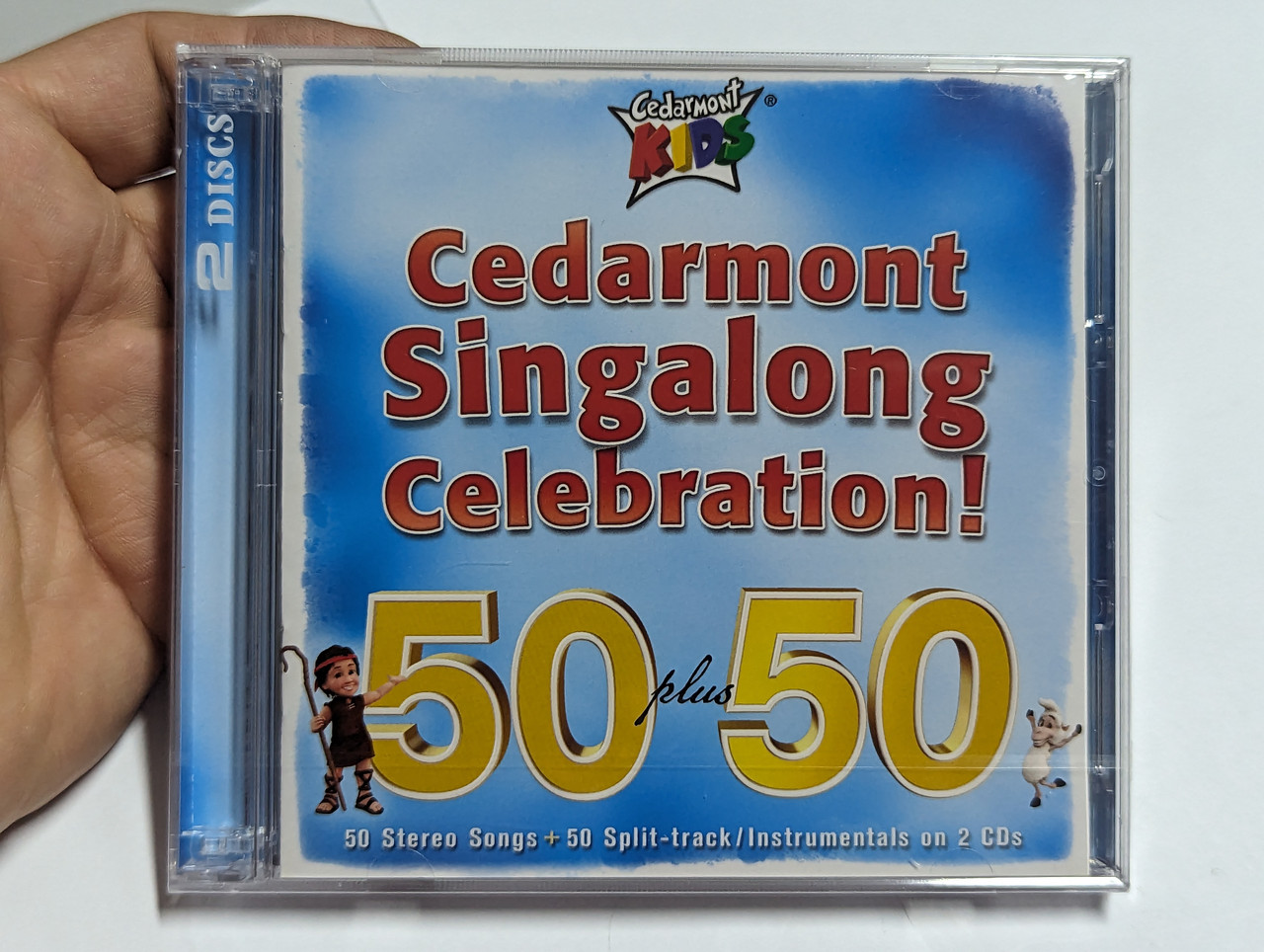 https://cdn10.bigcommerce.com/s-62bdpkt7pb/products/0/images/304235/Cedarmont_Singalong_Celebration_50_plus_50_50_Stereo_Songs_50_Split-trackInstrumentals_on_2_CDs_Cedarmont_Music_2x_Audio_CD_2010_84418-0753-2_1__50640.1697604548.1280.1280.jpg?c=2&_gl=1*shlf5s*_ga*MjA2NTIxMjE2MC4xNTkwNTEyNTMy*_ga_WS2VZYPC6G*MTY5NzYwMzUxNC4xMTA3LjEuMTY5NzYwNDMxMC40Mi4wLjA.