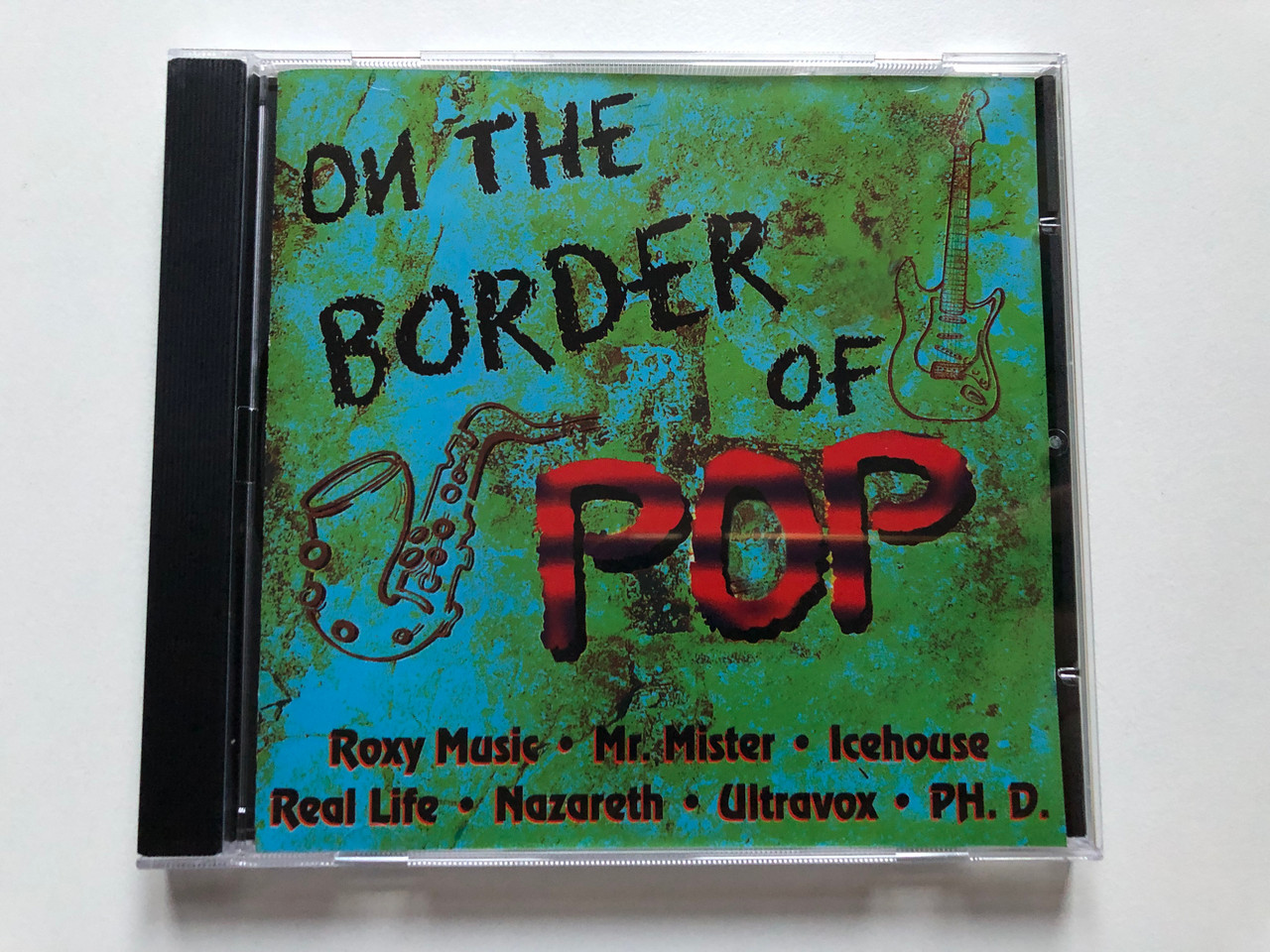 https://cdn10.bigcommerce.com/s-62bdpkt7pb/products/0/images/304958/On_The_Border_Of_Pop_-_Roxy_Music_Mr._Mister_Icehouse_Real_Life_Nazereth_Ultravox_PH._D._ZYX_Music_Audio_CD_1996_ZYX_55049-2_1__24827.1697782682.1280.1280.JPG?c=2&_gl=1*13slsej*_ga*MjA2NTIxMjE2MC4xNTkwNTEyNTMy*_ga_WS2VZYPC6G*MTY5Nzc3ODUwNi4xMTEwLjEuMTY5Nzc4MjUxMS40OC4wLjA.