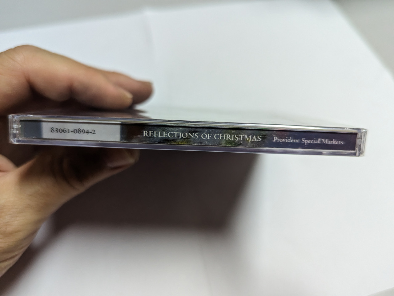 https://cdn10.bigcommerce.com/s-62bdpkt7pb/products/0/images/305056/Reflections_Of_Christmas_Provident_Label_Group_Audio_CD_2008_83061-0894-2_3__27865.1697786763.1280.1280.jpg?c=2&_gl=1*sh2slg*_ga*MjA2NTIxMjE2MC4xNTkwNTEyNTMy*_ga_WS2VZYPC6G*MTY5Nzc3ODUwNi4xMTEwLjEuMTY5Nzc4NjU4Mi41MC4wLjA.