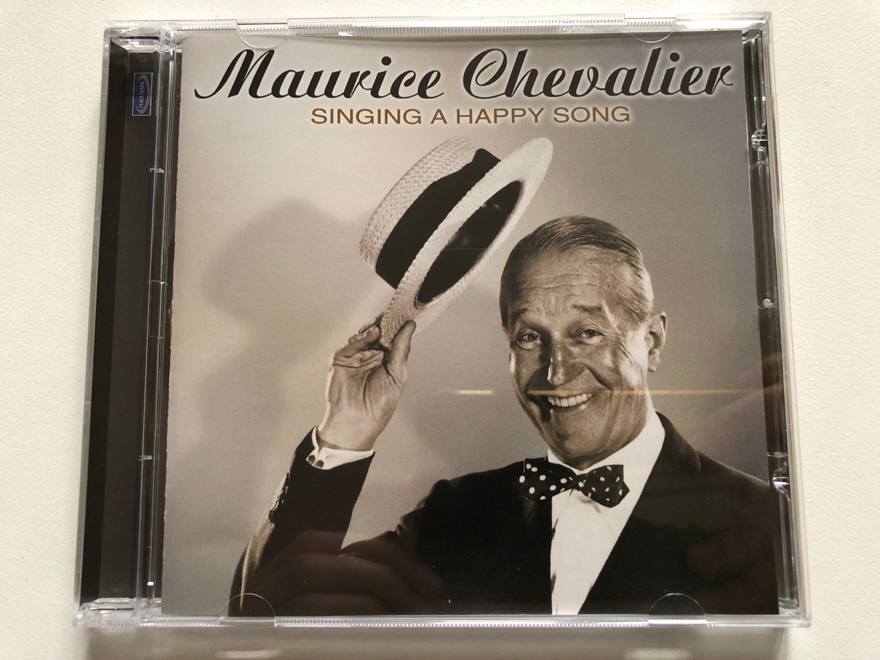 https://cdn10.bigcommerce.com/s-62bdpkt7pb/products/0/images/306217/Maurice_Chevalier_Singing_A_Happy_Song_Hallmark_Music_Audio_CD_2005_704152_1__47192.1698165058.1280.1280.JPG?c=2
