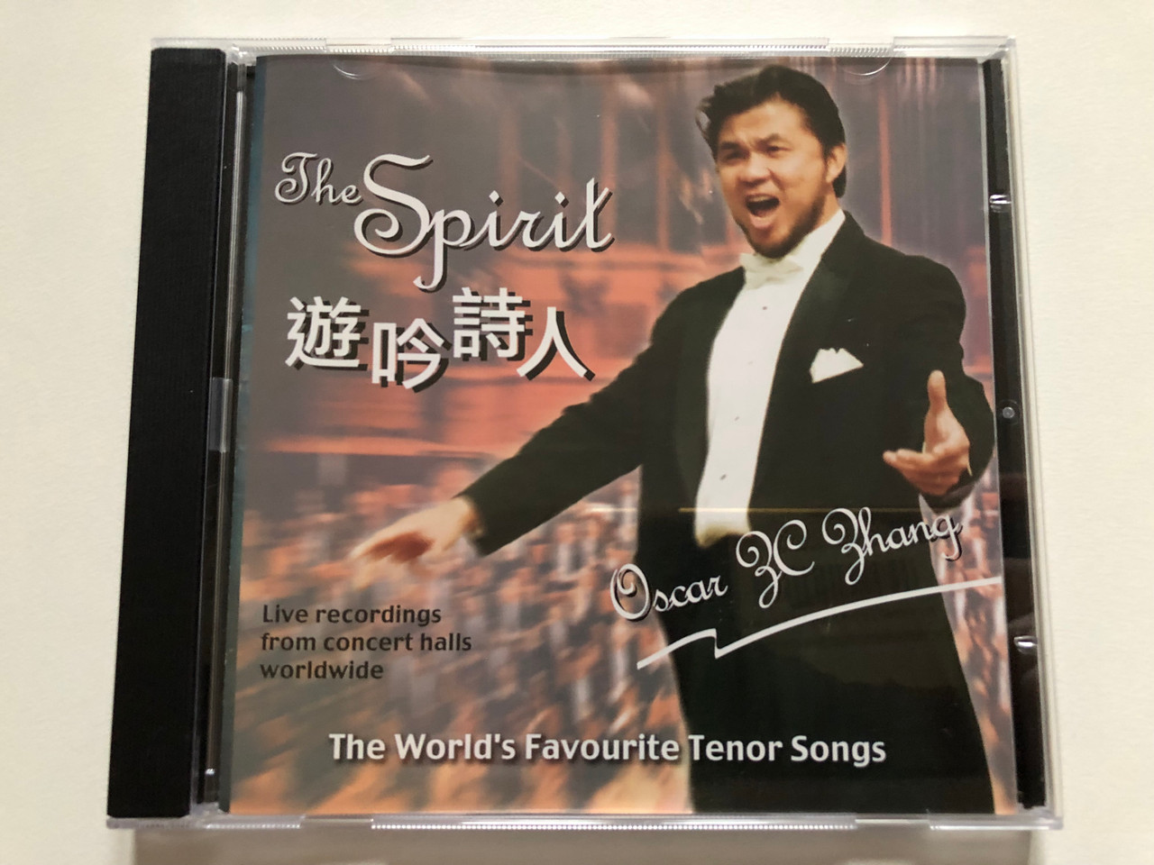 https://cdn10.bigcommerce.com/s-62bdpkt7pb/products/0/images/306363/The_Spirit_-_Oscar_ZC._Zhang_The_Worlds_Favourite_Tenor_Songs_Live_recordings_from_concert_halls_worldwide_Amor_Entertainment_Production_Audio_CD_2004_1__90318.1698241289.1280.1280.JPG?c=2