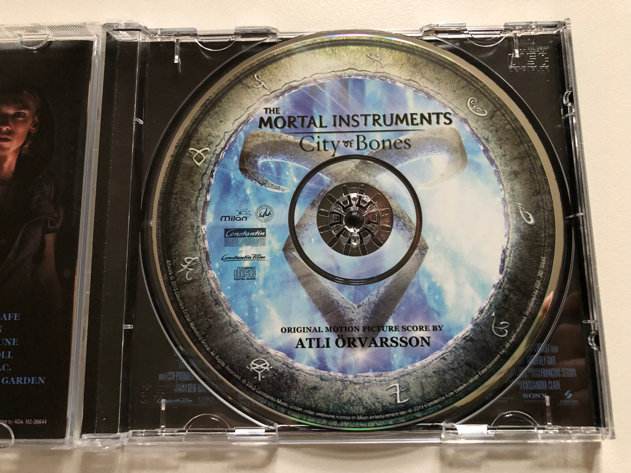 https://cdn10.bigcommerce.com/s-62bdpkt7pb/products/0/images/306463/The_Mortal_Instruments_City_Of_Bones_Original_Motion_Picture_Score_By_Atli_rvarsson_Milan_Audio_CD_2013_M2-36644_3__49039.1698252983.1280.1280.JPG?c=2