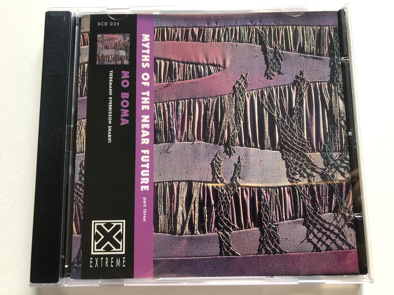 https://cdn10.bigcommerce.com/s-62bdpkt7pb/products/0/images/307381/Mo_Boma_Myths_Of_The_Near_Future_Part_Three_Extreme_Audio_CD_1996_XCD_035_1__99617.1698650429.1280.1280.JPG?c=2