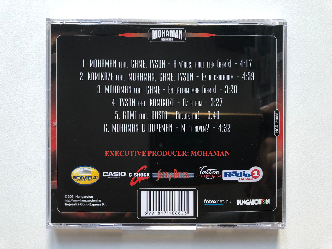 https://cdn10.bigcommerce.com/s-62bdpkt7pb/products/0/images/307425/Mohaman_Da_Flava_Csald_2001_Game_Mohaman_Tyson_Peppino_Busta_Funk_N._Stein_bonus_Mohaman_Dopeman_-_Mi_e_nevem_Hungaroton_Audio_CD_2001_HCD_71068-2_2__32367.1698658094.1280.1280.JPG?c=2