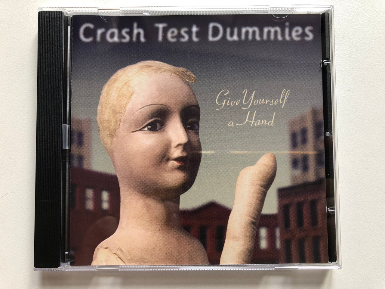 https://cdn10.bigcommerce.com/s-62bdpkt7pb/products/0/images/307627/Crash_Test_Dummies_Give_Yourself_A_Hand_Vik_Recordings_Audio_CD_1998_74321_63822_2_1__95518.1698765334.1280.1280.JPG?c=2