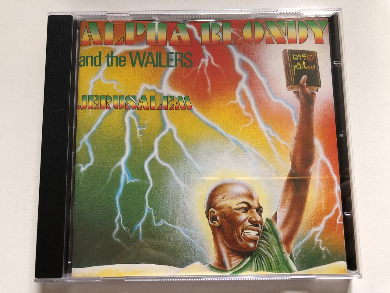 https://cdn10.bigcommerce.com/s-62bdpkt7pb/products/0/images/310472/Alpha_Blondy_And_The_Wailers_Jrusalem_Path_Audio_CD_1986_7464642_1__28488.1699379445.1280.1280.JPG?c=2