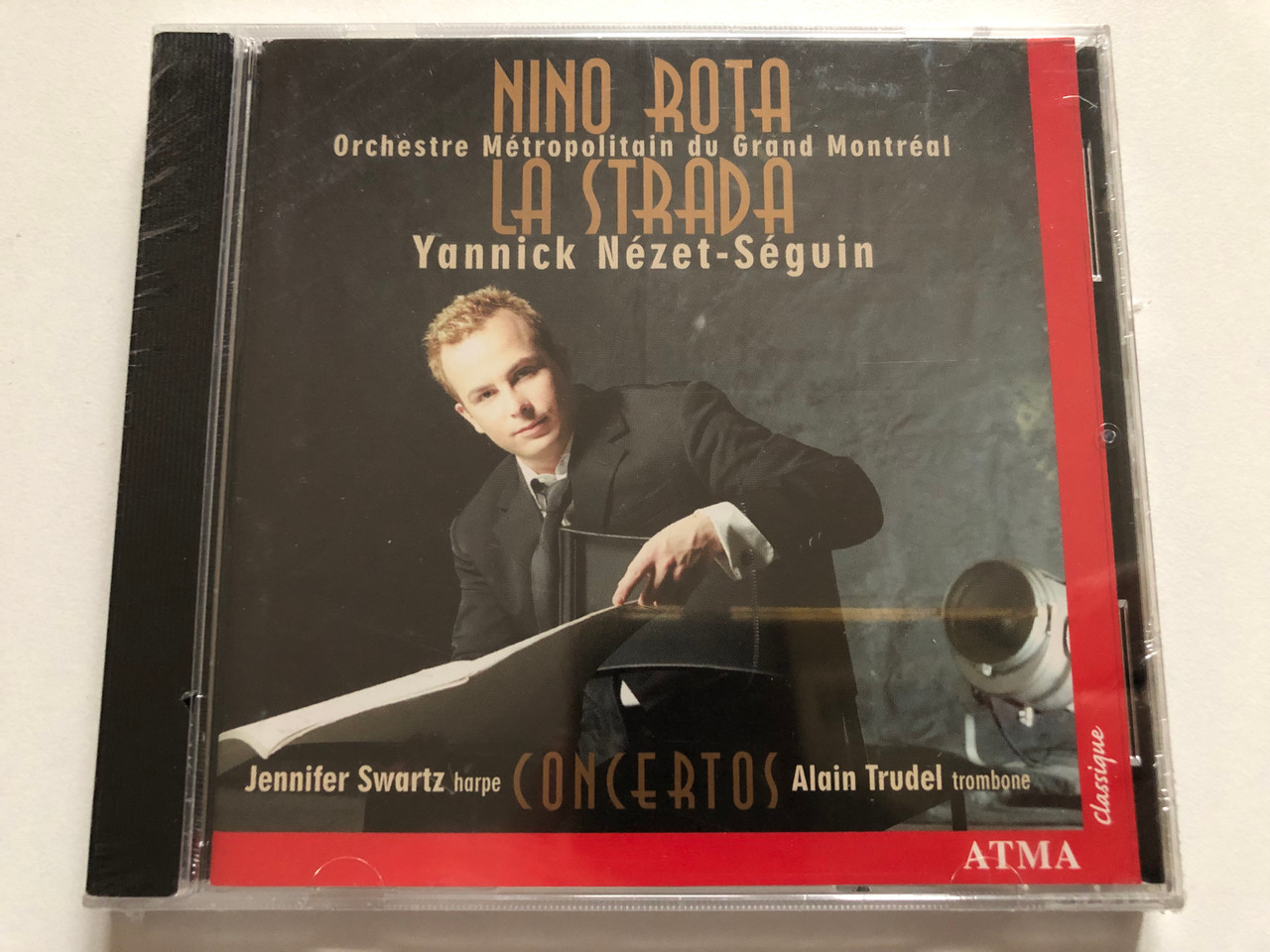 https://cdn10.bigcommerce.com/s-62bdpkt7pb/products/0/images/311981/Nino_Rota_-_La_Strada_Concertos_-_Orchestre_Mtropolitain_du_Grand_Montral_Yannick_Nzet-Sguin_Jennifer_Swartz_harpe_Alain_Trudel_trombone_Atma_Classique_Audio_CD_ACD2_2294_1__11809.1699862149.1280.1280.JPG?c=2