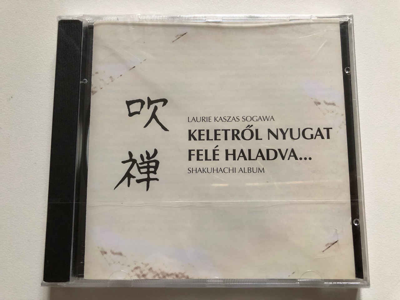 https://cdn10.bigcommerce.com/s-62bdpkt7pb/products/0/images/312273/Laurie_Kaszas_Sogawa_Keletrol_Nyugat_Fele_Haladva..._Shakuhachi_Album_Tom-Tom_Audio_CD_2001_1__89548.1699959295.1280.1280.JPG?c=2