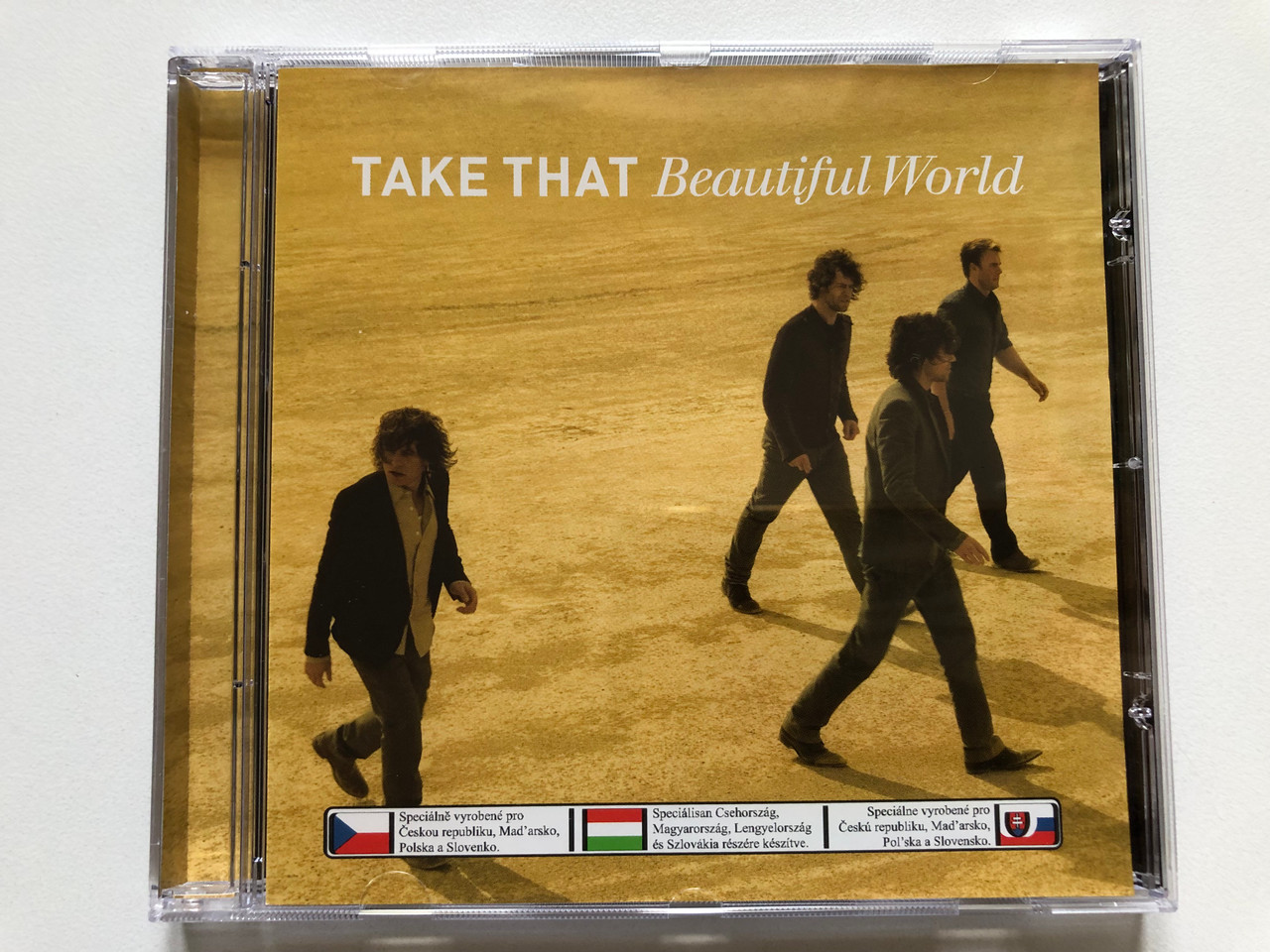https://cdn10.bigcommerce.com/s-62bdpkt7pb/products/0/images/313256/Take_That_Beautiful_World_Polydor_Audio_CD_2006_171_667-3_1__26161.1700595090.1280.1280.JPG?c=2