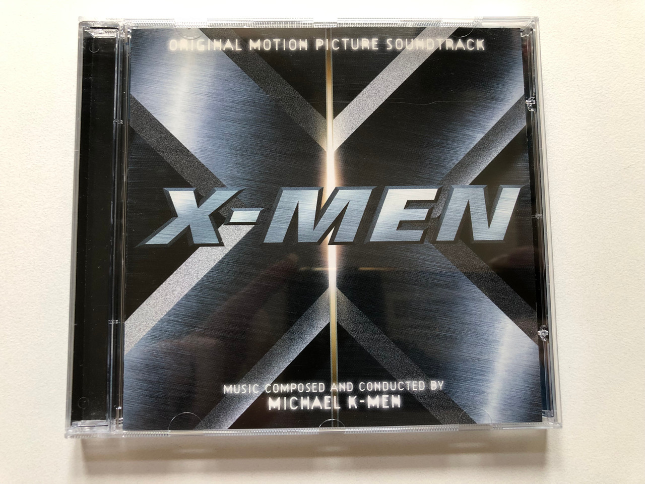 https://cdn10.bigcommerce.com/s-62bdpkt7pb/products/0/images/313266/X-Men_Original_Motion_Picture_Soundtrack_-_Music_Composed_And_Conducted_By_Michael_K-Men_Decca_Audio_CD_2000_467_270-2_1__25430.1700646759.1280.1280.JPG?c=2