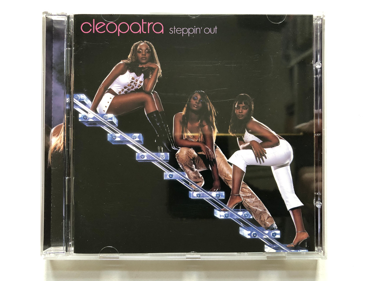 https://cdn10.bigcommerce.com/s-62bdpkt7pb/products/0/images/313376/Cleopatra_Steppin_Out_WEA_Audio_CD_2000_8573837152_1__69384.1700749354.1280.1280.JPG?c=2