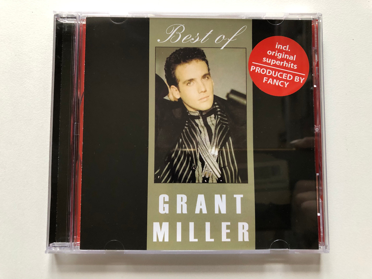 https://cdn10.bigcommerce.com/s-62bdpkt7pb/products/0/images/313412/Best_Of_Grant_Miller_-_incl._original_superhits_Produced_by_Fancy_B.W._Music_Audio_CD_455102_1__04076.1700757876.1280.1280.JPG?c=2