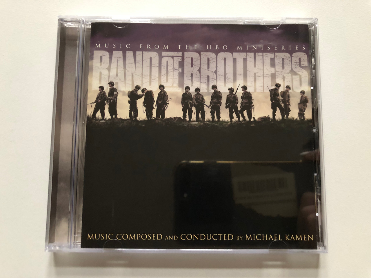 https://cdn10.bigcommerce.com/s-62bdpkt7pb/products/0/images/313460/Band_Of_Brothers_Music_From_The_HBO_Miniseries_-_Music_Composed_And_Conducted_by_Michael_Kamen_Play-Tone_Audio_CD_2001_SK_89719_1__66362.1700838915.1280.1280.JPG?c=2