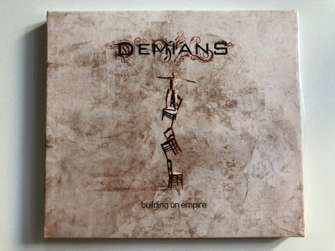 https://cdn10.bigcommerce.com/s-62bdpkt7pb/products/0/images/313881/Demians_Building_An_Empire_Inside_Out_Music_Audio_CD_2008_IOMCD_293_1__34394.1701161020.1280.1280.JPG?c=2