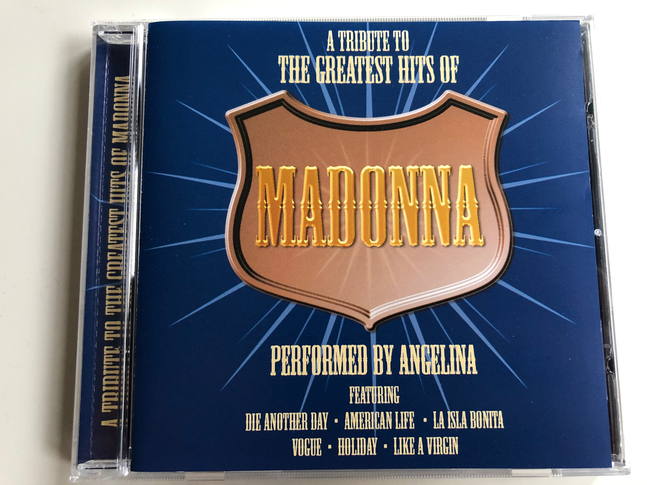 A Tribute To The Greatest Hits Of Madonna / Performed By Angelina /  Featuring Die Another Day, American Life, La Isla Bonita, Vogue, Holiday,  Like A
