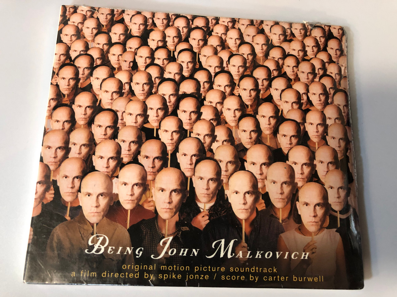 https://cdn10.bigcommerce.com/s-62bdpkt7pb/products/28111/images/168348/Being_John_Malkovich_Original_Motion_Picture_Soundtrack_A_film_directed_by_Spike_Jonze_Score_by_Carter_Burwell_Source_Audio_CD_1999_724384876401_1__81916.1613475530.1280.1280.JPG?c=2&_ga=2.174093862.543434869.1618406858-6505287.1618406858