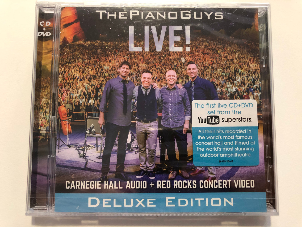 https://cdn10.bigcommerce.com/s-62bdpkt7pb/products/29470/images/175686/The_Piano_Guys_Live_Carnegie_Hall_Audio_Red_Rocks_Concert_Video_Deluxe_Edition_The_First_Live_CD_DVD_set_from_the_YouTube_Superstar_Portrait_Audio_CD_DVD_2015_88875123662_1__99242.1618907808.1280.1280.JPG?c=2&_ga=2.223542302.425983966.1618922532-1242530367.1618922532