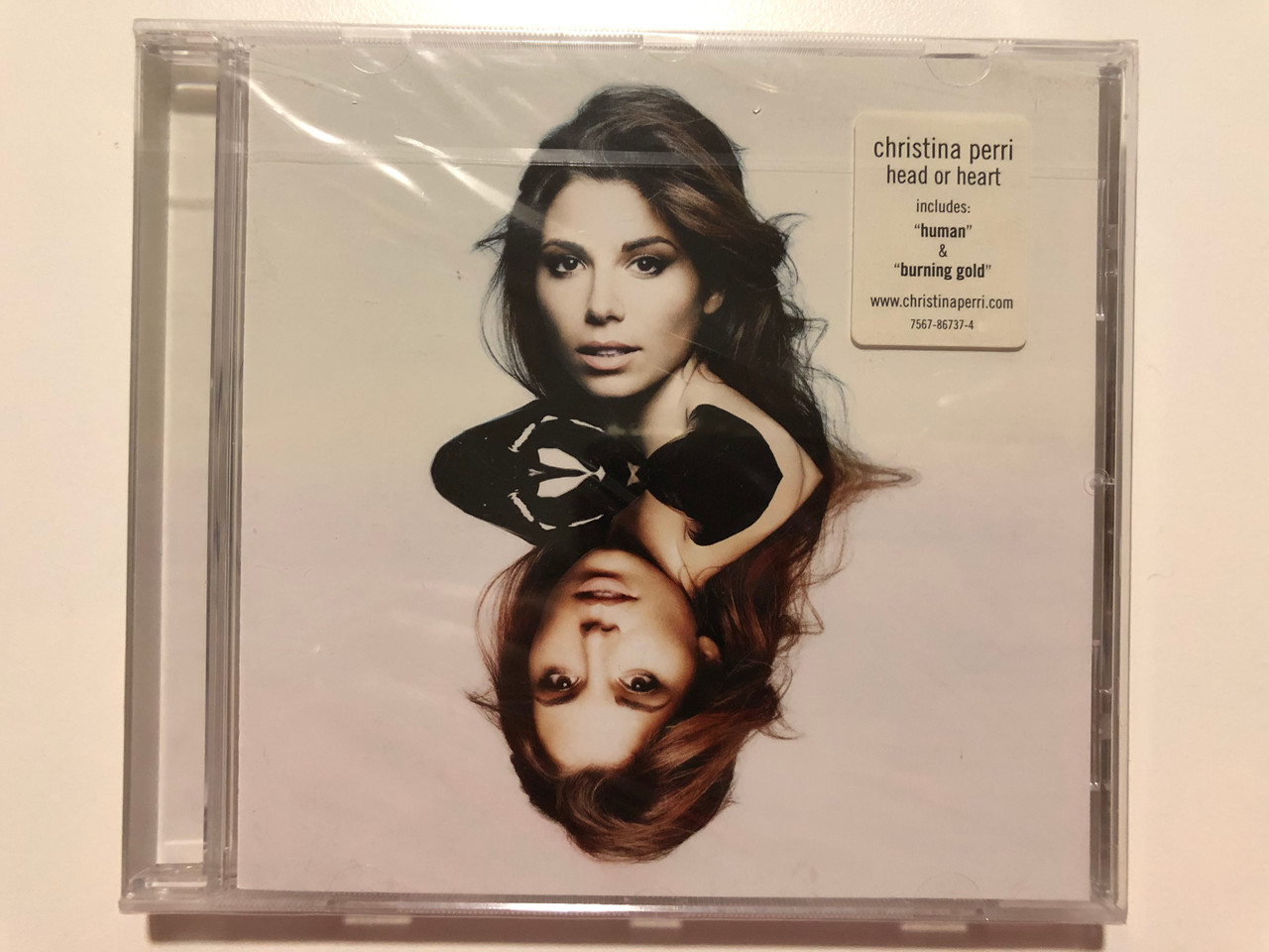 https://cdn10.bigcommerce.com/s-62bdpkt7pb/products/29762/images/177242/Christina_Perri_Head_Or_Heart_Includes_Human_Burning_Gold_Atlantic_Audio_CD_2014_7567-86737-4_1__37877.1620027649.1280.1280.JPG?c=2&_ga=2.125602377.2142011239.1620029029-598537477.1620029029
