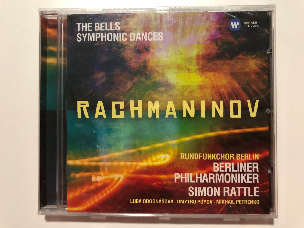 https://cdn10.bigcommerce.com/s-62bdpkt7pb/products/29793/images/177345/The_Bells_Symphonic_Dances_-_Rachmaninov_Rundfunkchor_Berlin_Berliner_Philharmoniker_Simon_Rattle_Luba_Orgonov_Dmytro_Popov_Mikhail_Petrenko_Warner_Classics_Audio_CD_2013_50999984_1__38961.1620122481.1280.1280.JPG?c=2&_ga=2.133533710.1294282105.1620933183-96777119.1620933183
