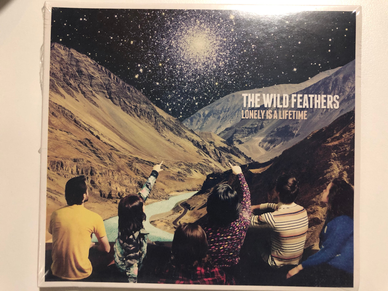 https://cdn10.bigcommerce.com/s-62bdpkt7pb/products/29828/images/177457/The_Wild_Feathers_Lonely_Is_A_Lifetime_Warner_Bros._Records_Audio_CD_2016_9362-49223-7_1__91817.1620212441.1280.1280.JPG?c=2&_ga=2.217927889.613799009.1620501054-800322906.1620501054