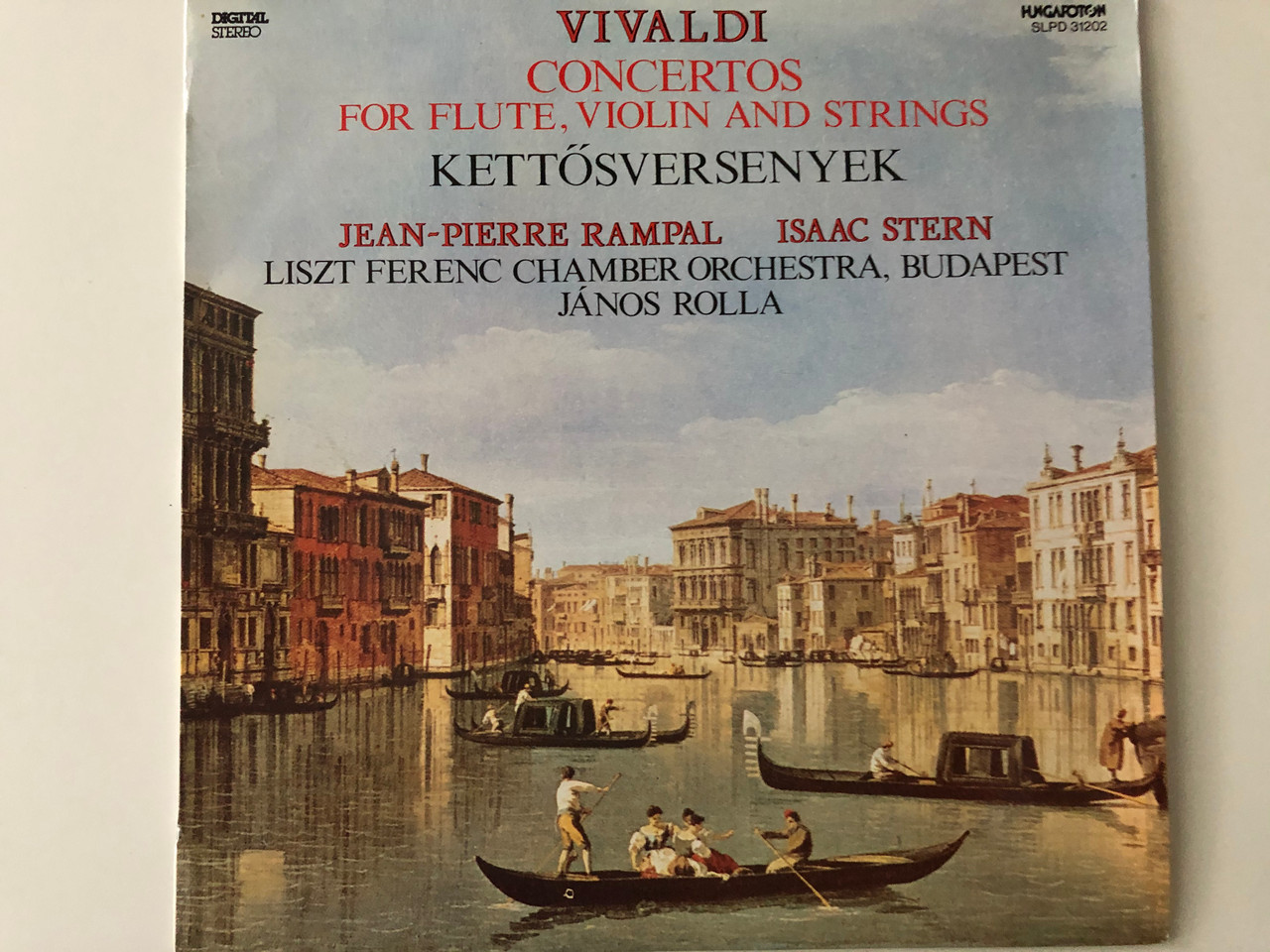 https://cdn10.bigcommerce.com/s-62bdpkt7pb/products/29990/images/178162/Vivaldi_Concertos_For_Flute_Violin_And_Strings_-_Kettsversenyek_Jean-Pierre_Rampal_Isaac_Stern_Liszt_Ferenc_Chamber_Orchestra_Budapest_Jnos_Rolla_Hungaroton_LP_1991_Stereo_SLPD_3120_1__09932.1620914631.1280.1280.JPG?c=2&_ga=2.225545818.1905557486.1620918311-1082871681.1620918311