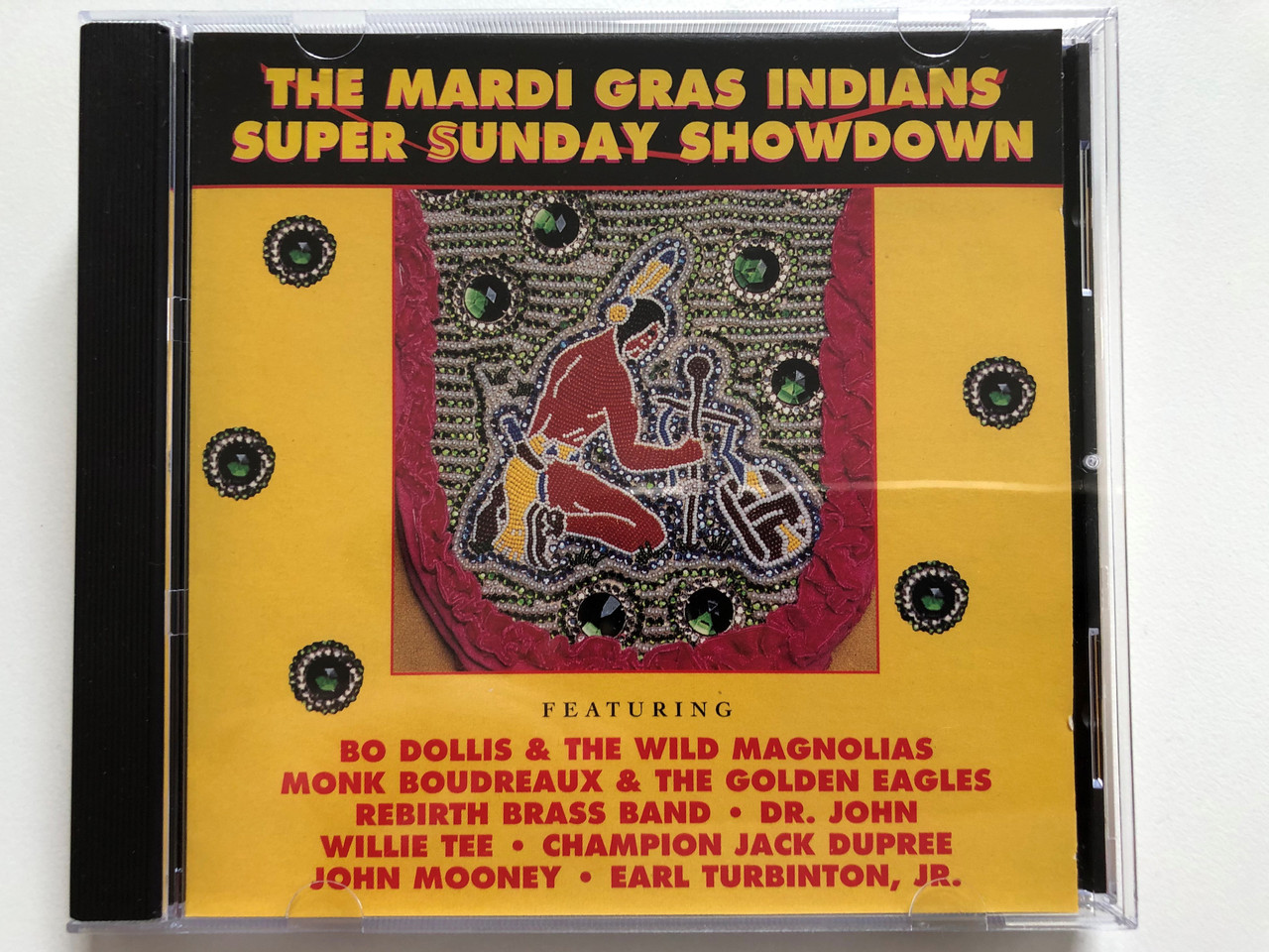 https://cdn10.bigcommerce.com/s-62bdpkt7pb/products/30293/images/179272/The_Mardi_Gras_Indians_Super_Sunday_Showdown_Featuring_Bo_Dollis_The_Wild_Magnolias_Monk_Boudreaux_The_Golden_Eagles_Rebirth_Brass_Band_Dr._John_Willie_Tee_Rounder_Records_Audio_CD_1__25660.1622100281.1280.1280.JPG?c=2&_ga=2.253380745.124754382.1622221975-1131994027.1622221975