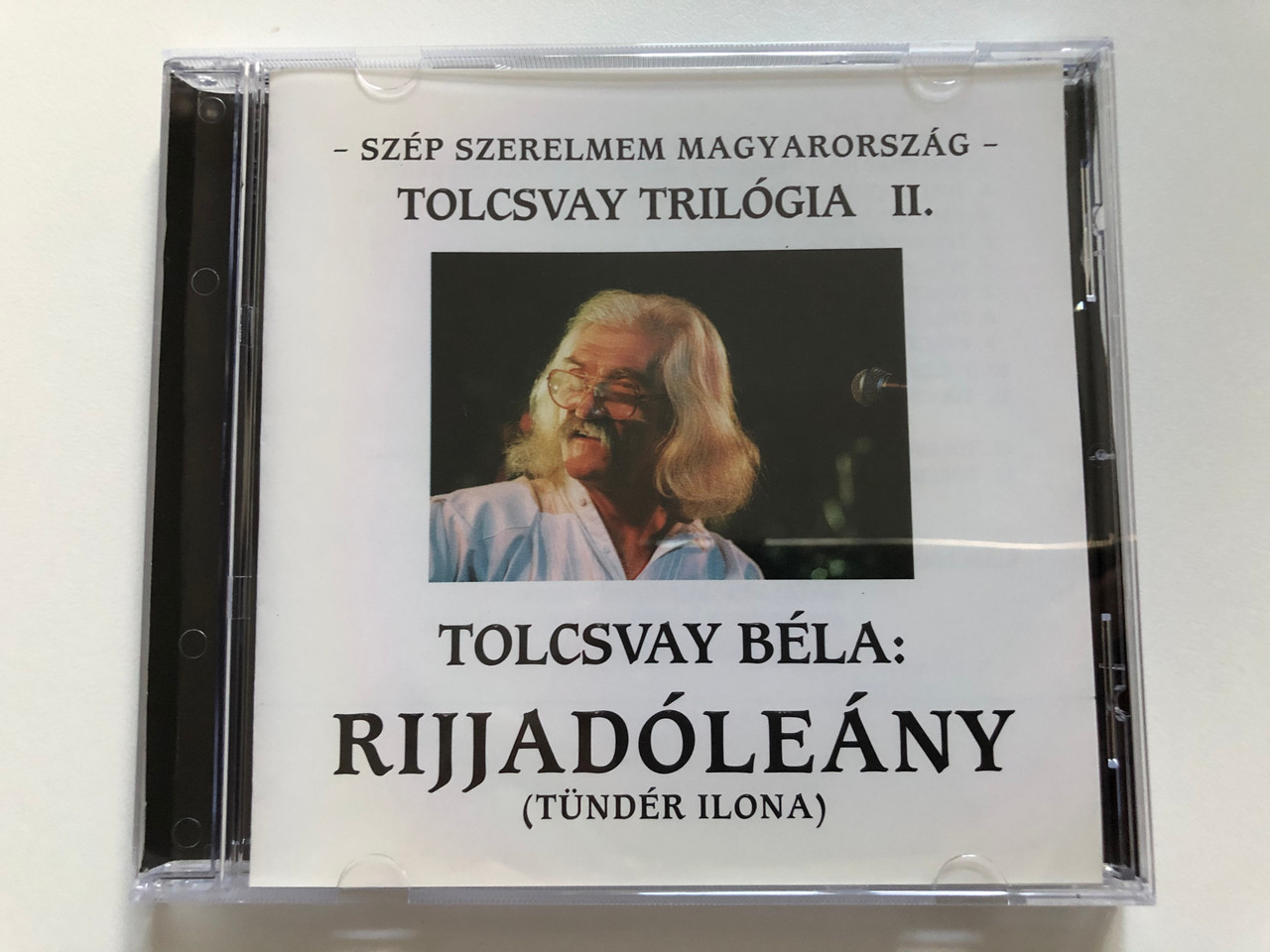 https://cdn10.bigcommerce.com/s-62bdpkt7pb/products/30555/images/180661/Szp_Szerelmem_Magyarorszg_-_Tolcsvay_Trilgia_-_II._Tolcsvay_Bla_Rijjadleny_Tndr_Ilona_Audio_CD_1999_1__51979.1623167879.1280.1280.JPG?c=2&_ga=2.148825265.700277554.1623167661-252145610.1623167661