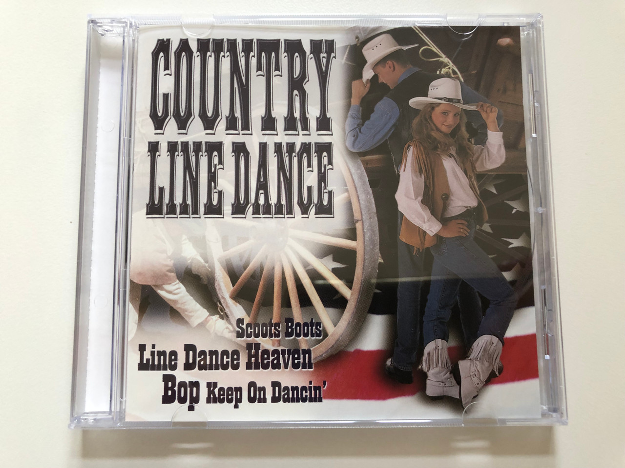 https://cdn10.bigcommerce.com/s-62bdpkt7pb/products/30691/images/181250/Country_Line_Dance_-_Scoots_Boots_Line_Dance_Heaven_Bop_Keep_On_Dancin_Weton-Wesgram_Audio_CD_2000_KBOX3227A_1__73912.1623663032.1280.1280.JPG?c=2&_ga=2.76346899.787544708.1623769862-1646000393.1623769862