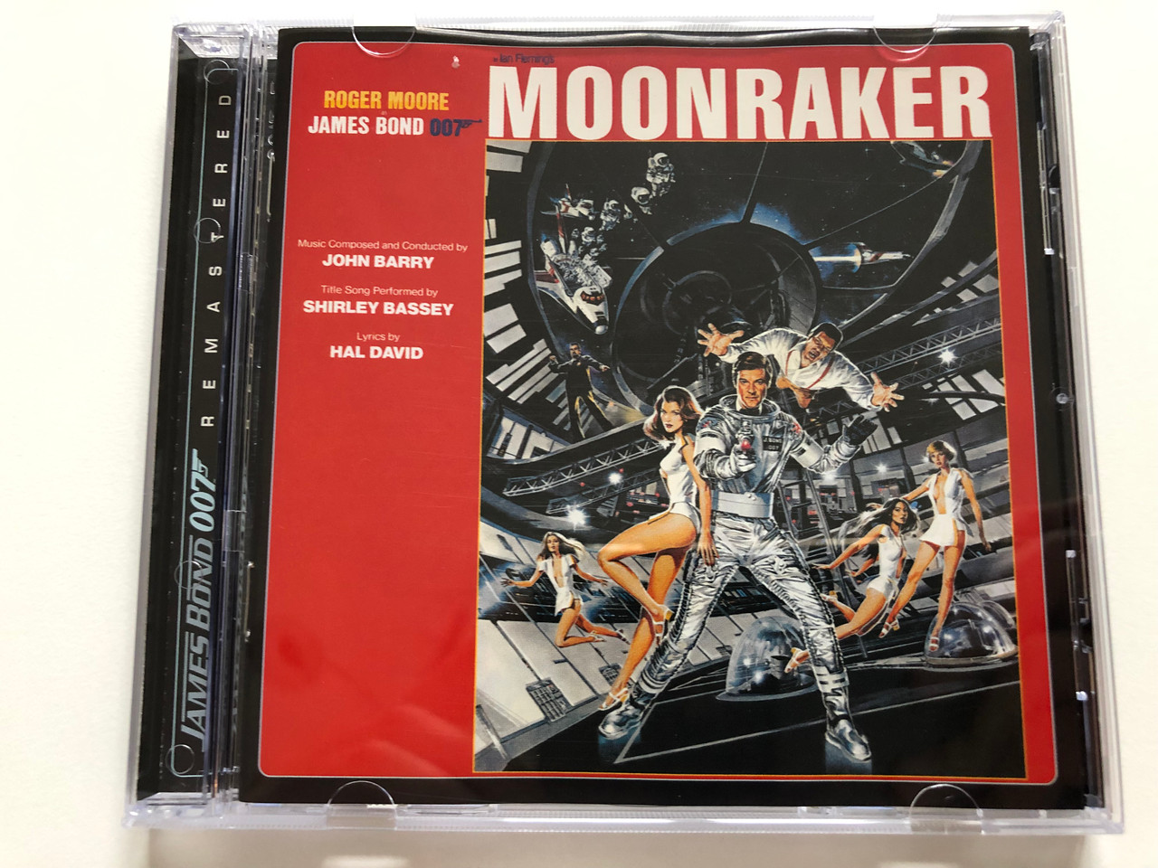 https://cdn10.bigcommerce.com/s-62bdpkt7pb/products/30863/images/182085/Moonraker_Roger_Moore_-_James_Bond_007_Music_Composed_and_Conducted_by_John_Barry_Title_Song_Performed_by_Shirley_Bassey_Lyrics_by_Hal_David_James_Bond_007_Remastered_Capitol_Records_Au_1__17469.1624291555.1280.1280.JPG?c=2