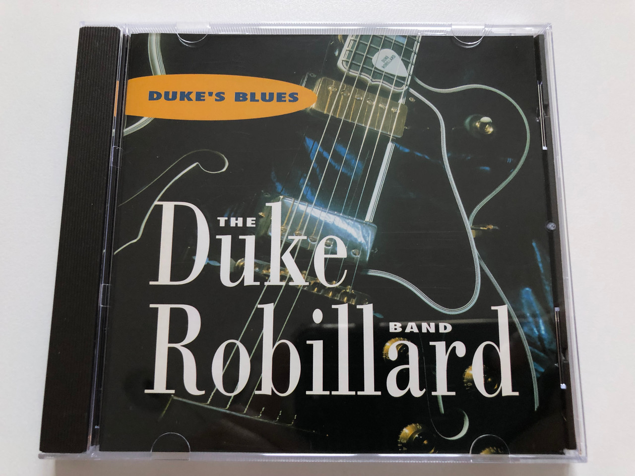 https://cdn10.bigcommerce.com/s-62bdpkt7pb/products/30883/images/182188/Dukes_Blues_-_The_Duke_Robillard_Band_Pointblank_Audio_CD_1994_724384134426_1__94336.1624372102.1280.1280.JPG?c=2