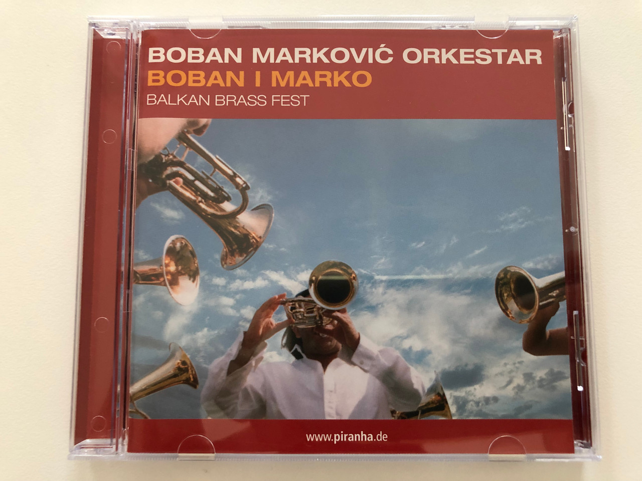 https://cdn10.bigcommerce.com/s-62bdpkt7pb/products/30905/images/182273/Boban_Markovi_Orkestar_-_Boban_I_Marko_-_Balkan_Brass_Fest_Piranha_Audio_CD_CD-PIR1790_1__51487.1624453259.1280.1280.JPG?c=2